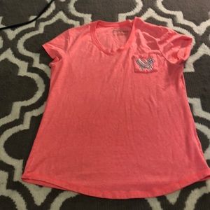 Orange shirt with butterfly pocket